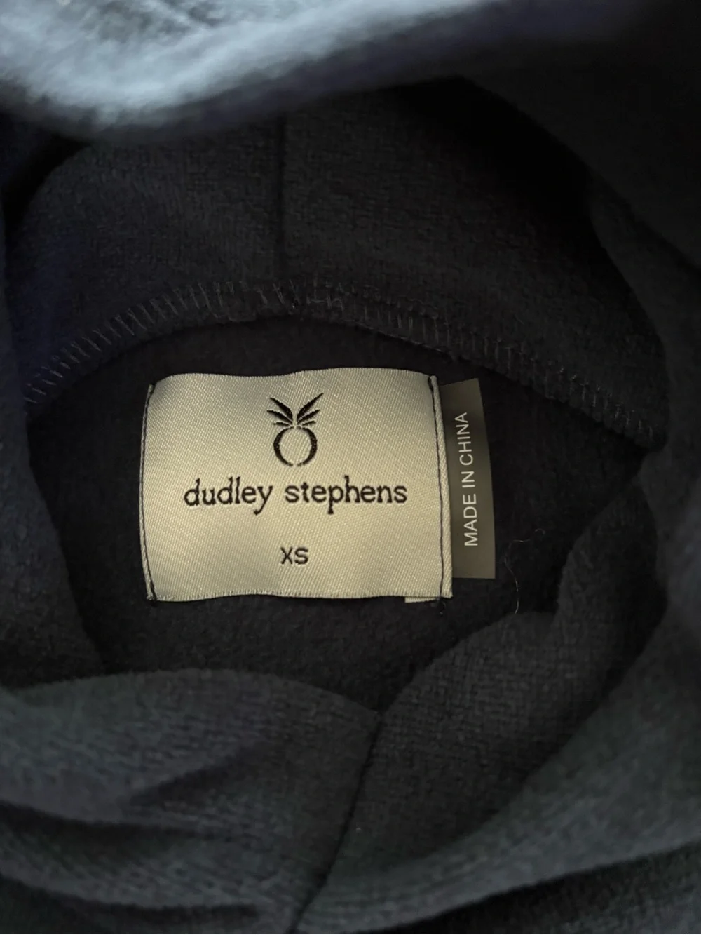 Dudley Stephens navy pullover with white logo label